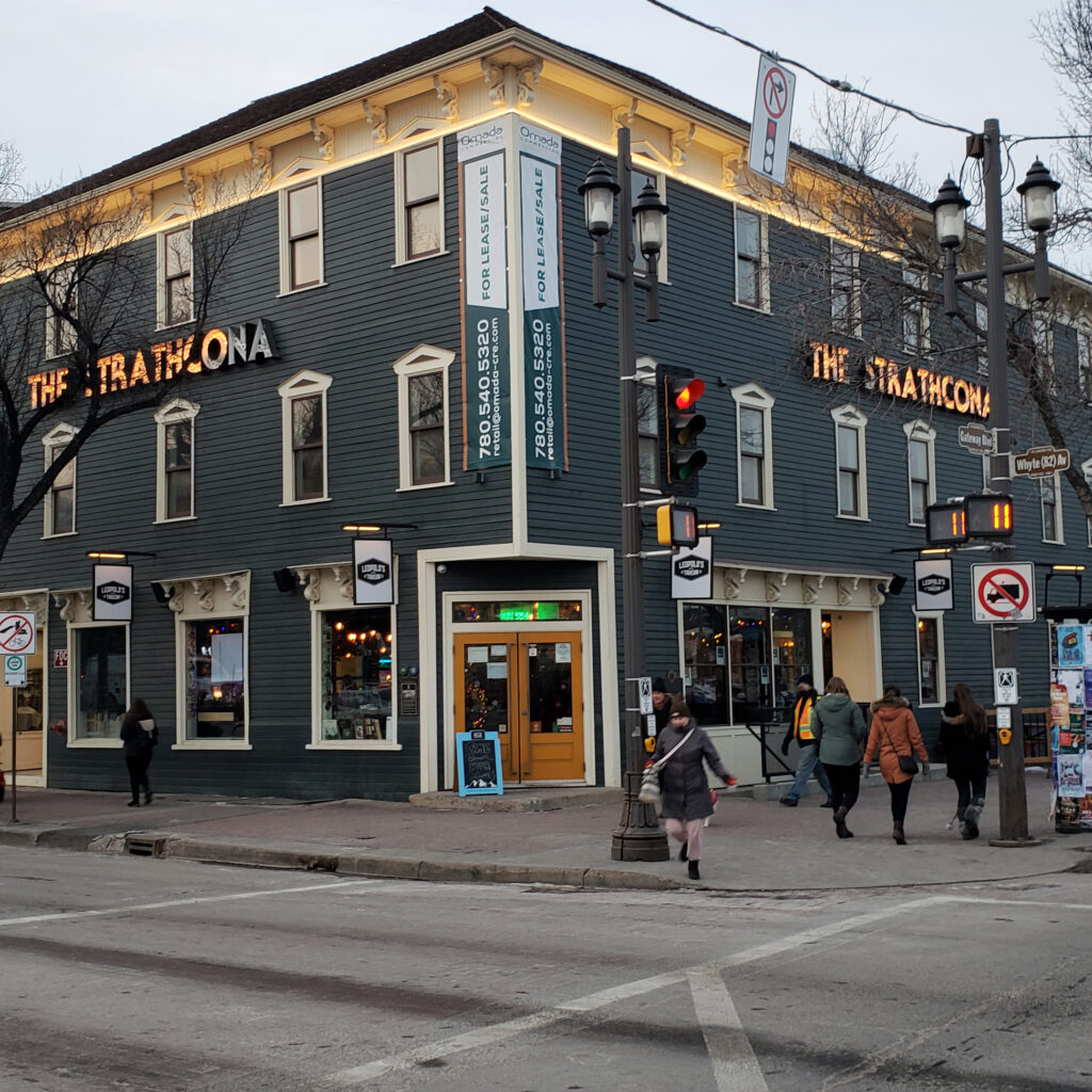 The Strathcona Hotel stands at the corner of Whyte Avenue and 103 Street