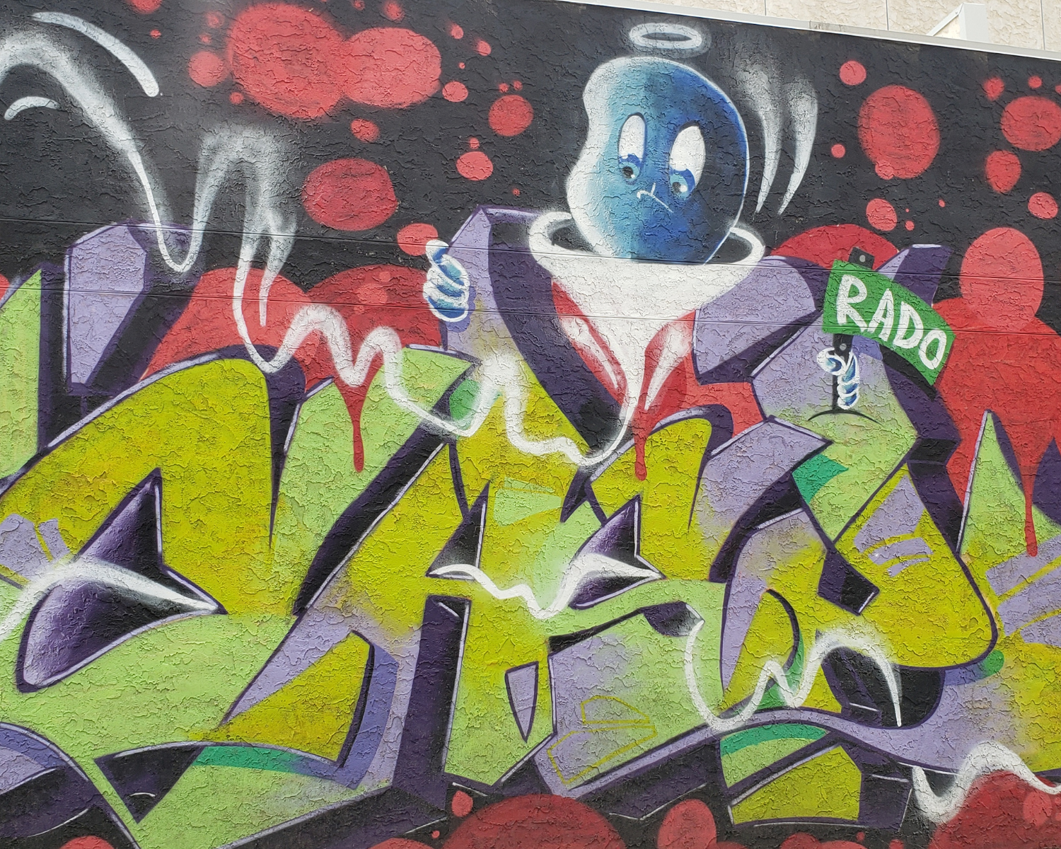 Casper the friendly ghost hovers over graffiti